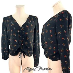 Urban Outfitters black top with dainty flowers and middle ruching with ties.